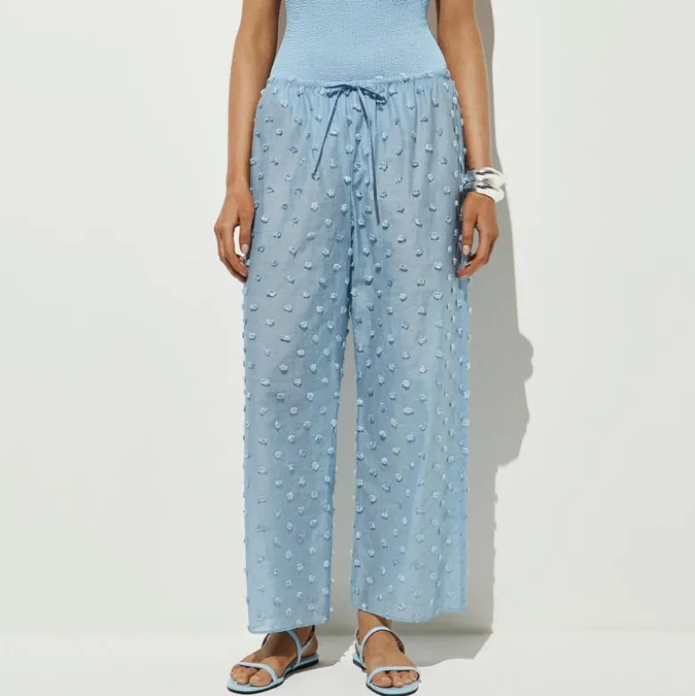 Beach pant with pom-poms