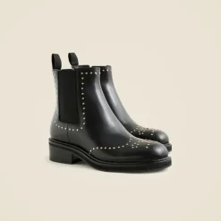 Chelsea wing tip boots in studded leather