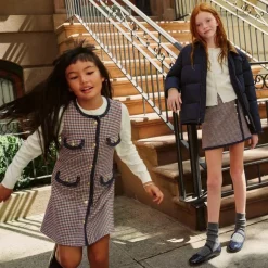 Girls' faux-wrap skirt in houndstooth