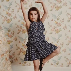 Girls' side-ruffle dress in eyelet