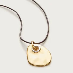 Grommet pendant necklace with leather cord