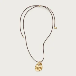 Grommet pendant necklace with leather cord