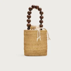 Handknotted rattan bucket bag with wood beads