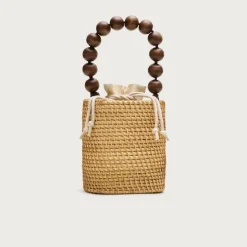 Handknotted rattan bucket bag with wood beads