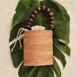 Handknotted rattan bucket bag with wood beads