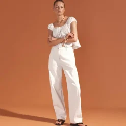 Lower-rise full-length slim-wide jean