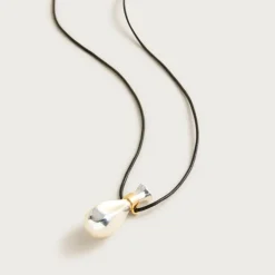 Metallic pendant necklace with leather cord