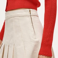 Pleated denim mini skirt in ecru
