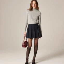 Pleated mini skirt with buckle detail