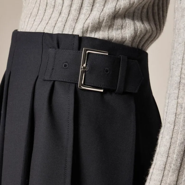 Pleated mini skirt with buckle detail