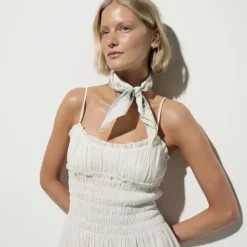 Smocked mini dress in Hampton linen-blend